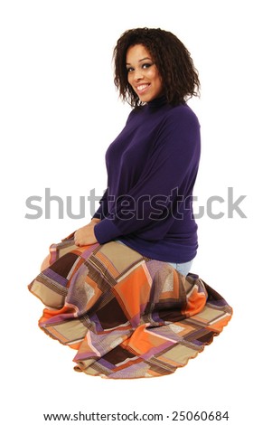 An attractive full figured model in a purple sweater.