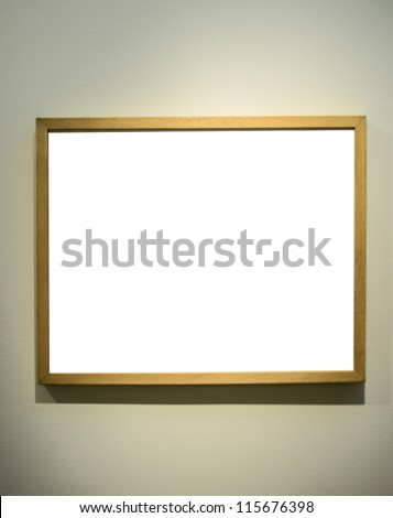 Empty picture frame on gallery wall