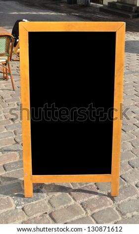Empty menu board standing on the street