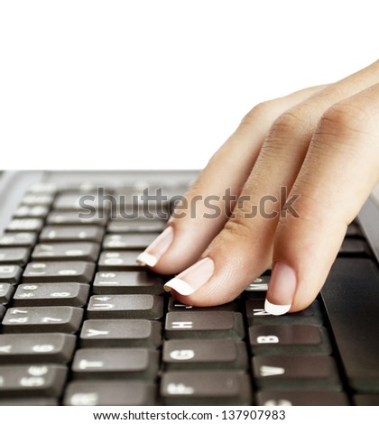 Female fingers typing on keyboard