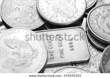 Silver coins and bars macro shot
