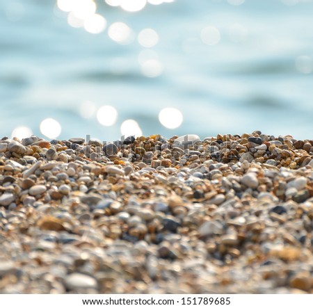 Stones on beach and sea water
