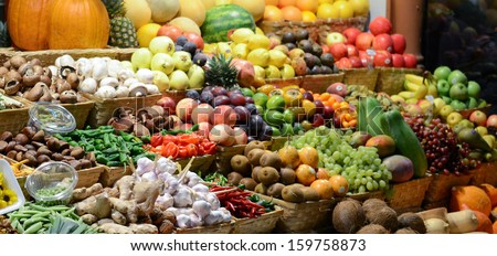 Fruit market with various colorful fresh fruits and vegetables - Market series