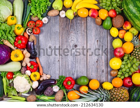Collection of fresh Fruit and vegetables on wooden table in form of frame - High quality studio shot