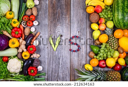 Huge group of fresh vegetables and fruit on wooden background - Vegetables VS Fruit - High quality studio shot