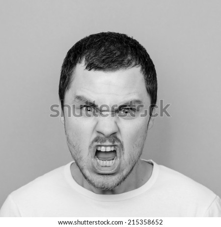 Portrait of angry man screaming - Monochrome or black and white portrait