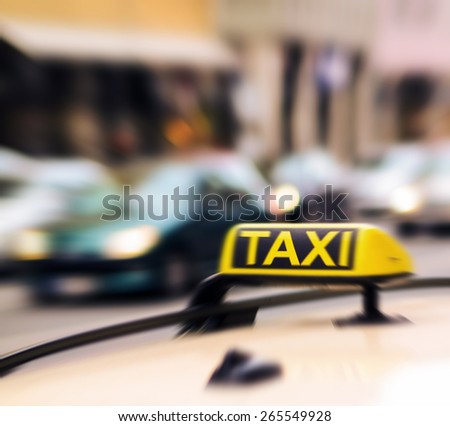 Taxi sign on car in motion blur