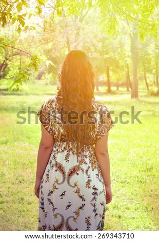 Portrait of woman looking forward from behind