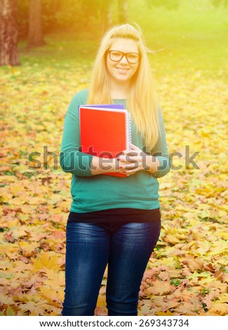 Portrait of happy blonde student girl
