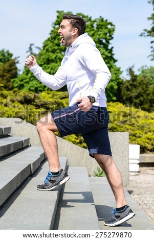 Practice - Close up of young man running up the stairs