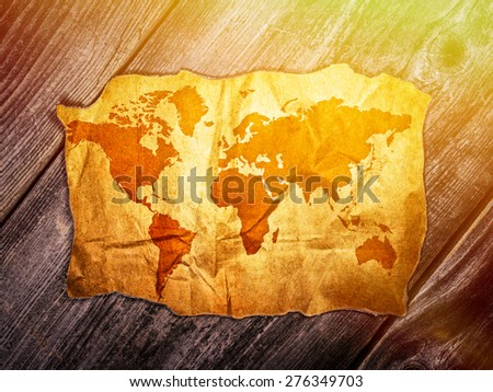 Old world map over wooden background