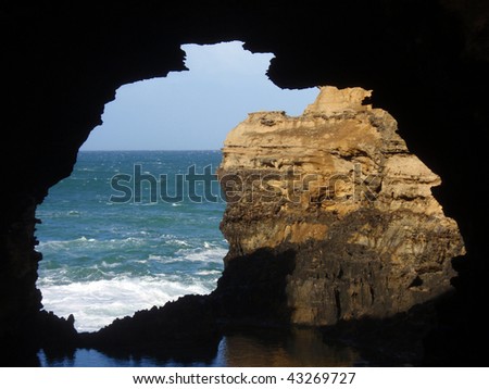 Rock window showing the ocean in shape of Australia continent