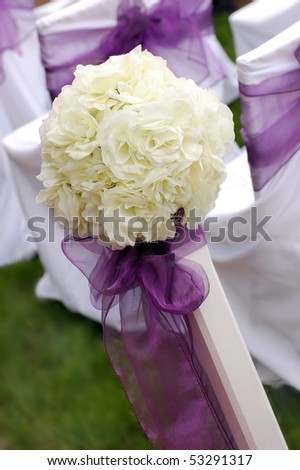 stock photo White roses wedding bouquet with violet ribbon