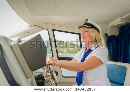 Woman-captain operates the small size vessel...