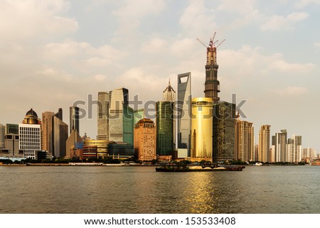panoramic view of shanghai skyline with huangpu river at dusk