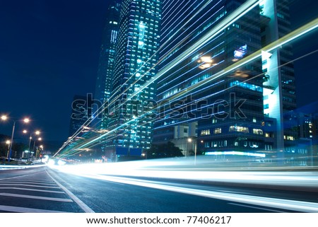 The urban landscape at night and through the city traffic