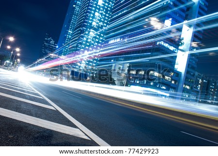 The urban landscape at night and through the city traffic
