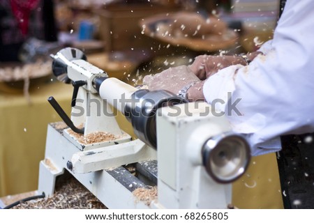 Man turning wood with lathe