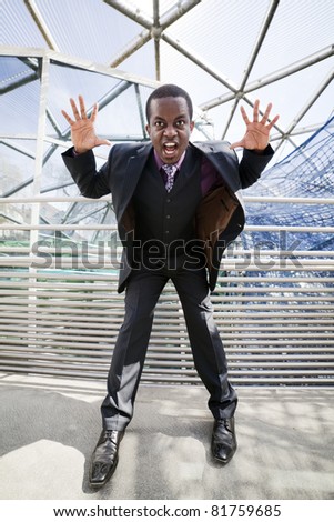 Black business man in grey suit with violet chemise getting crazy. Modern spider architecture as symbol for business network or social network.