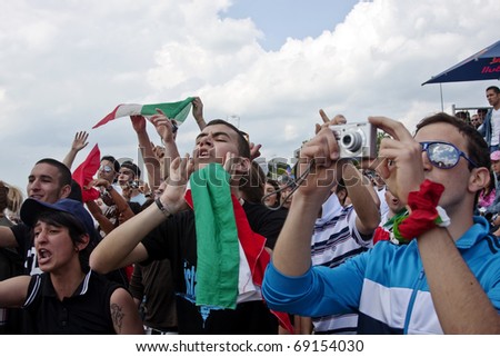 ISTANBUL, TURKEY - MAY 23 : Italian fans cheers their  aviation team in flying festival at Caddebostan coast on May 23, 2010 in Istanbul, Turkey.