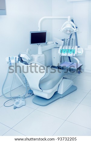The interior of a dentist office with blue ambient light