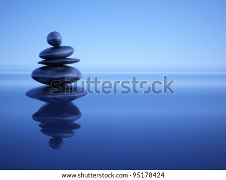 Zen stones in water under blue ambient light