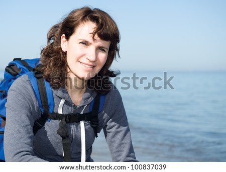 Close-Up portrait of hiking relaxing woman at sea