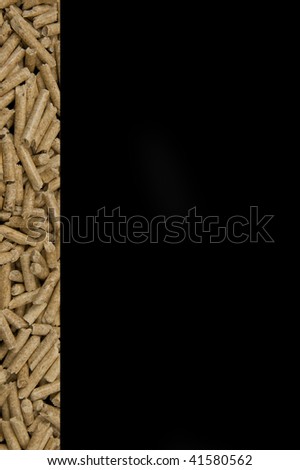 Wood pellets line on black background