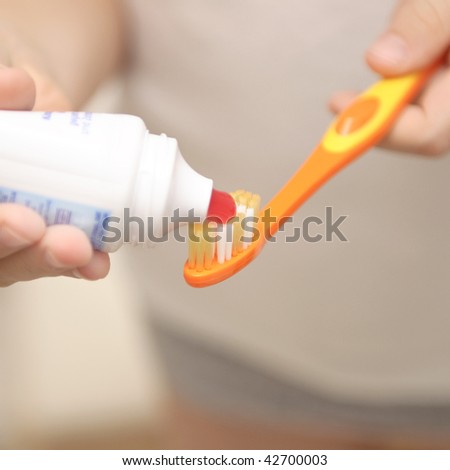 Brush and tooth-paste in the child hands
