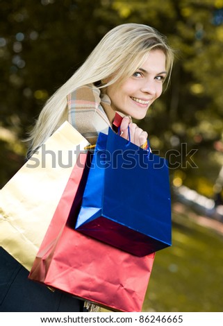 Young happy beauty woman with shopping bags
