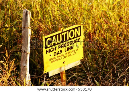Sign warning of a buried gas transmission line.