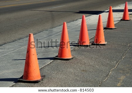 Orange cones used to close off a street.