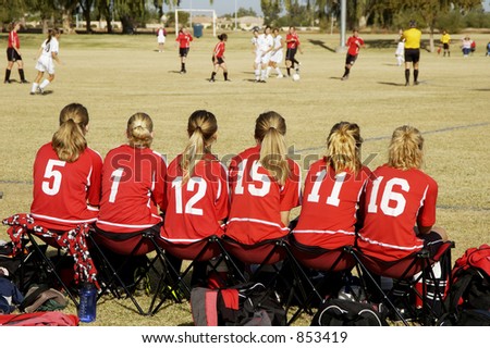 Sidelines at a girl\'s soccer game.