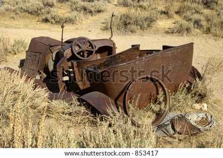 stock photo Rusty old car in a ghost town in California