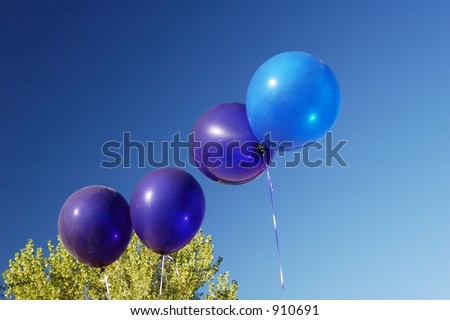 blue balloons at a parade.