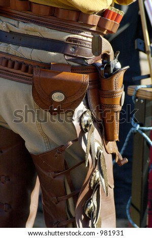 A cowboy waits his turn at a shooting competition.
