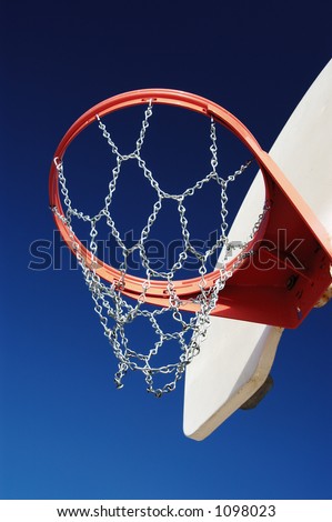 Basketball hoop with chain net in a city park.