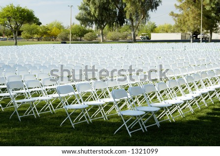 Folding chairs set up for a college graduation ceremony.