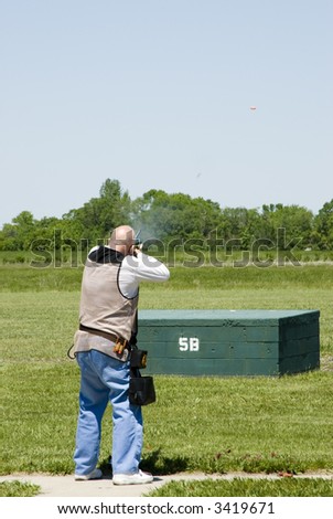 shooting clay pigeons at a trap shoot range