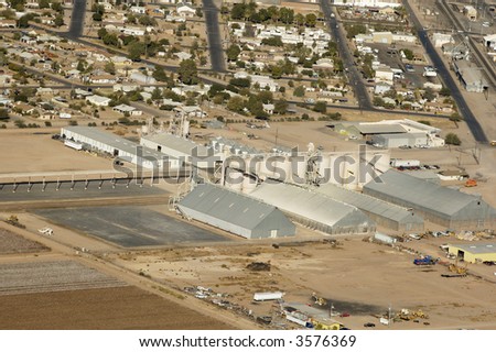 aerial view of a cotton gin located beside a housing development in Arizona.