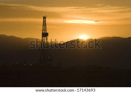 oil and gas drilling rig at sunrise in Wyoming