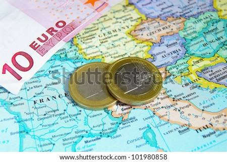 closeup of map of Europe and Euro coins