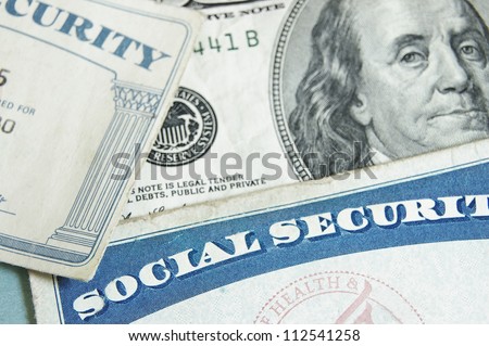 social security cards and US money - retirement concept