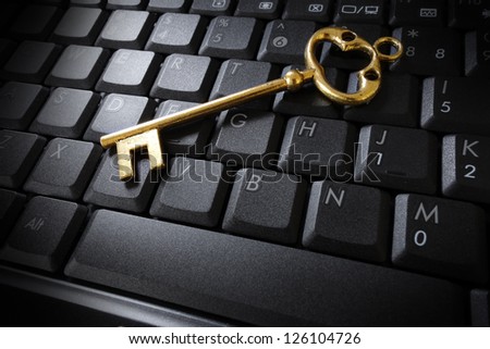 gold key on a computer keyboard