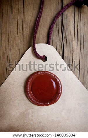 a blank circular wax stamp on vintage paper with string