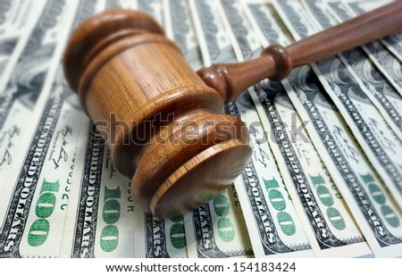 court gavel on $100 bills - legal concept