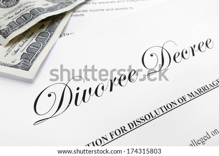 Closeup of a divorce decree and money