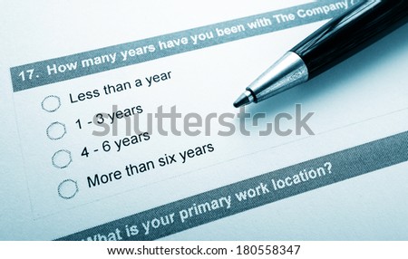 Closeup of an employee opinion survey and pen