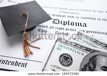 School diploma and mini grad cap with cash