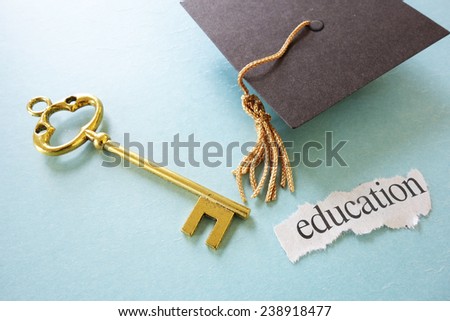 Education paper scrap with graduation mortar board and gold key